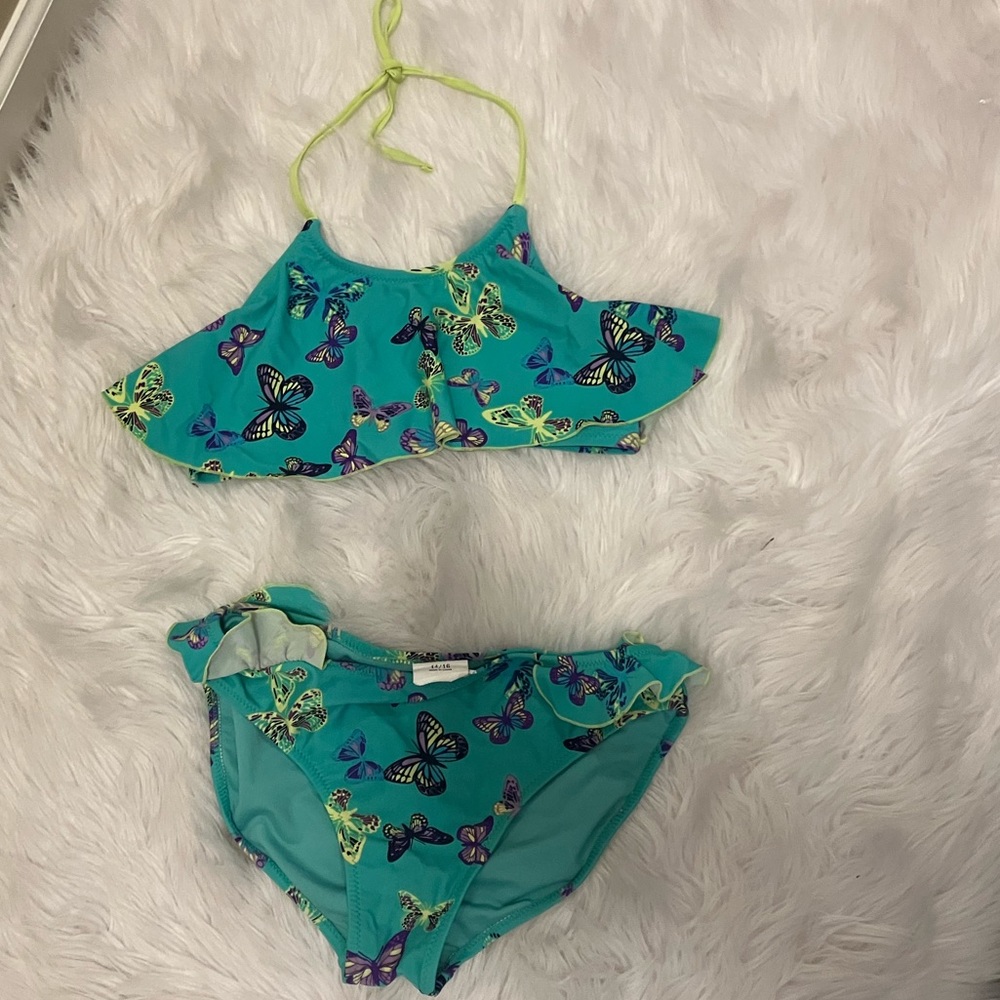 Cute two piece bathing suit from Wave Zone. With butterflies and front flap.